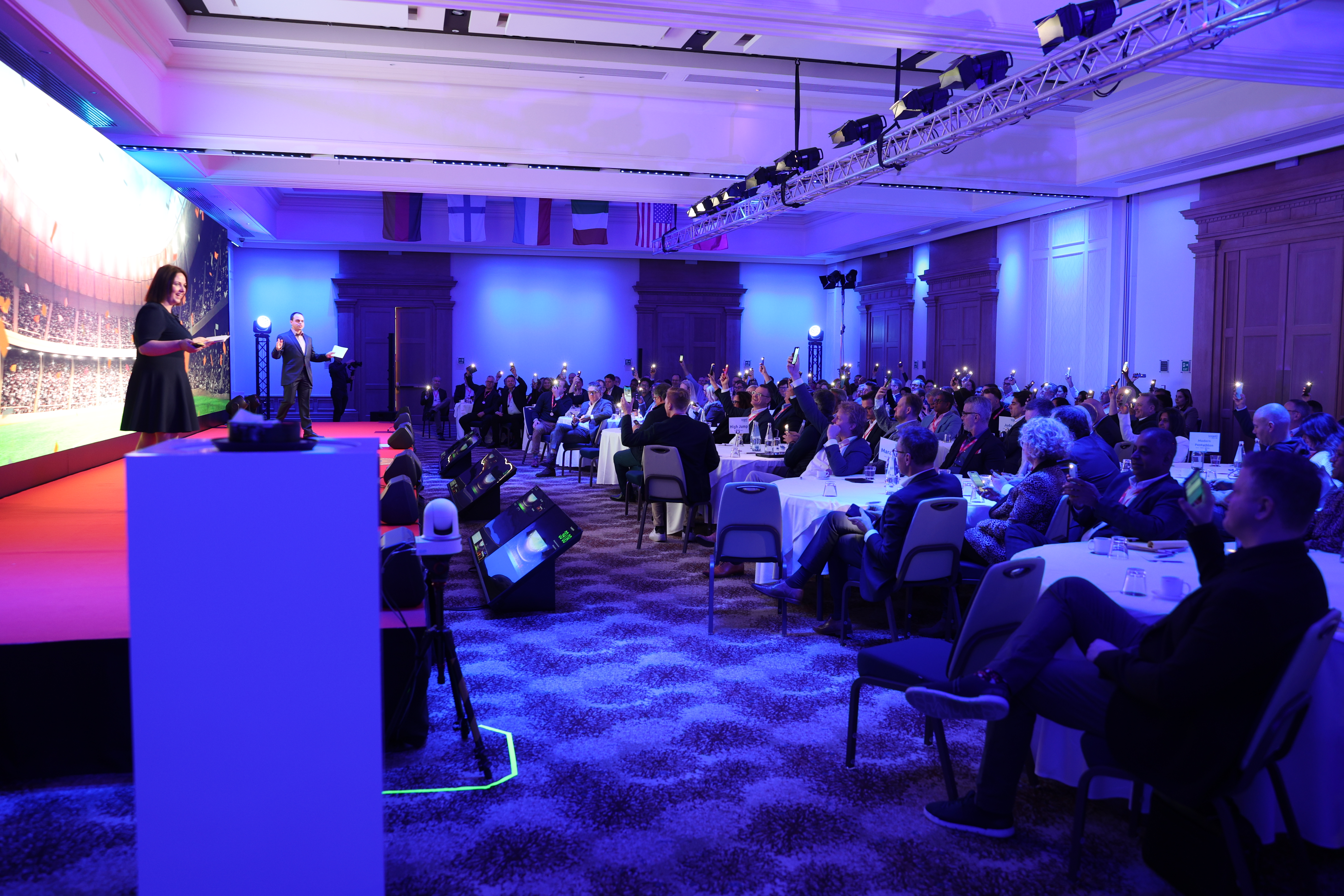 A group of people sitting at tables in a room