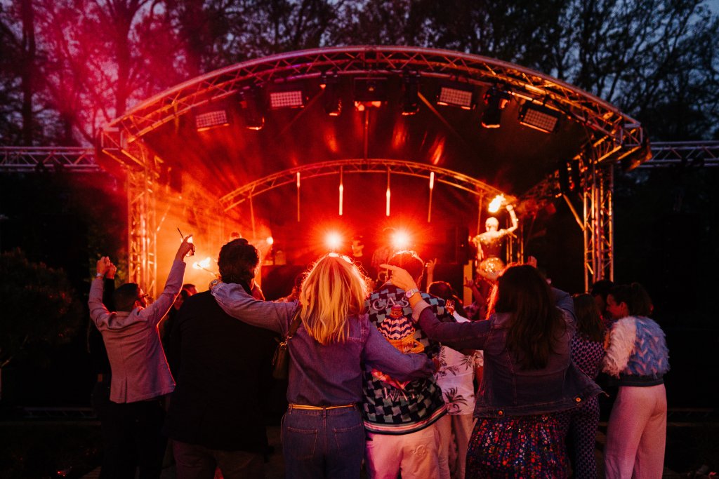 A group of people looking at a stage.