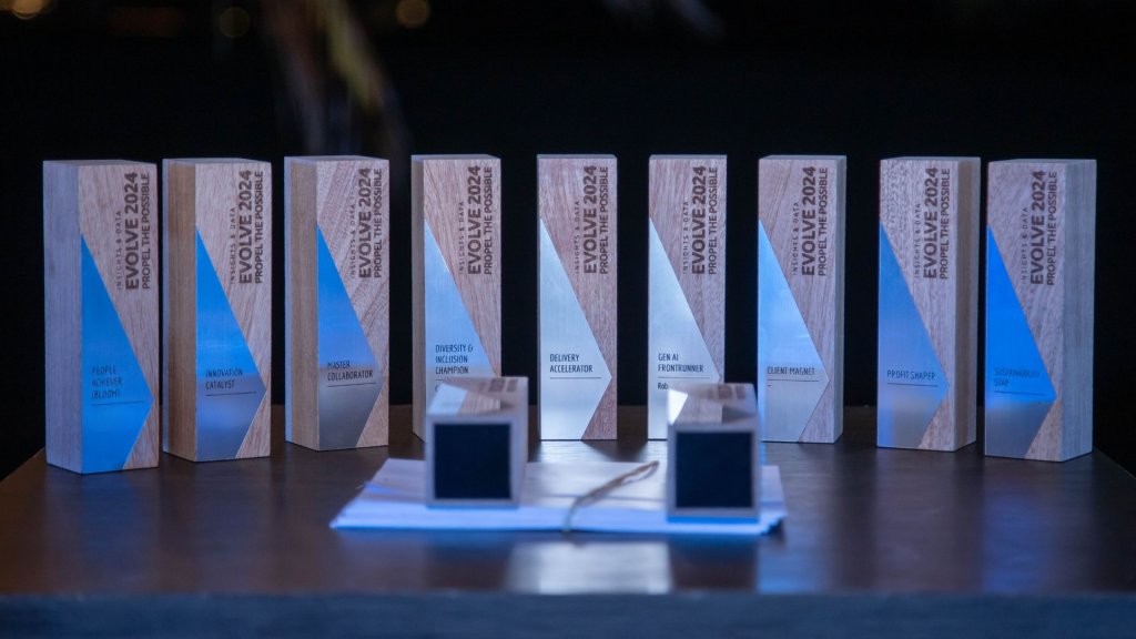 A group of trophies on a table.